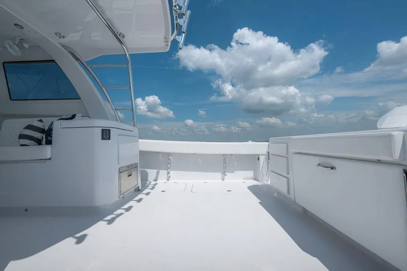Slide: The Image of Spacious deck of 2026 Toro Yachts Toro 42 under a bright blue sky. - 28