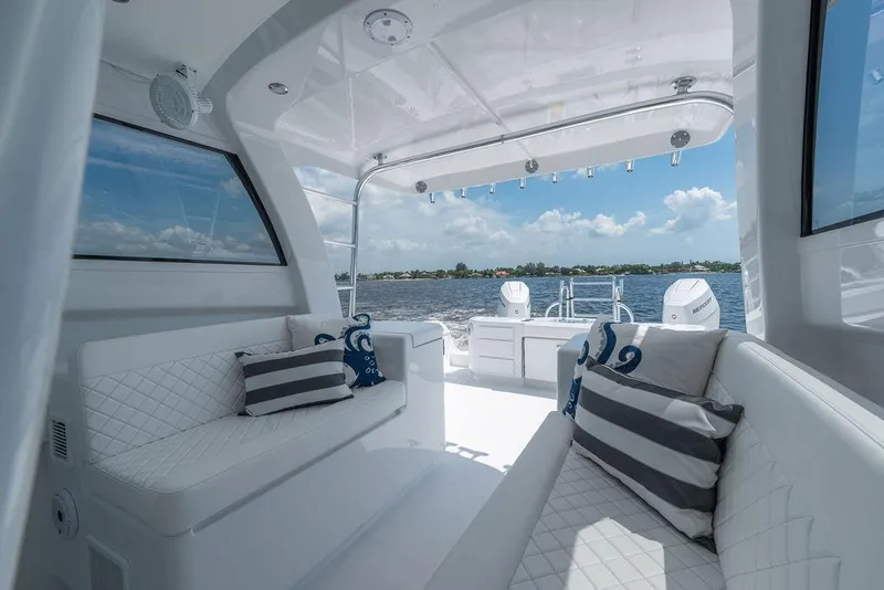 Slide: The Image of Luxurious interior of 2026 Toro Yachts Toro 42, featuring elegant seating and scenic ocean view. - 19