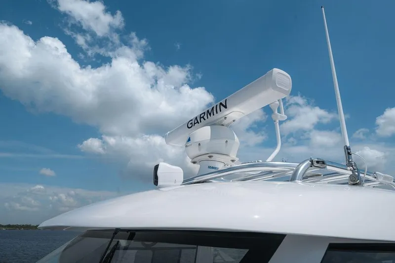 Slide: The Image of Radar equipment on 2026 Toro Yachts Toro 42 under a clear blue sky. - 30