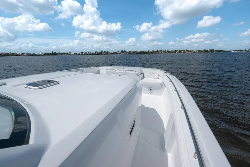 Slide: The Image of 2026 Toro Yachts Toro 42 on calm waters under a blue sky. - 39
