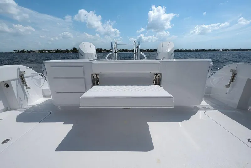 Slide: The Image of Sleek 2026 Toro Yachts Toro 42 with spacious deck and luxurious seating, overlooking serene waters. - 40