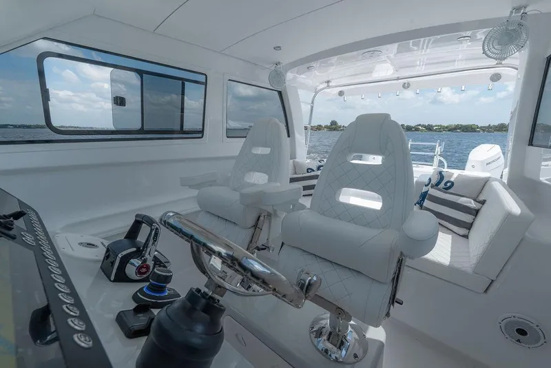 Slide: The Image of Luxurious interior of 2026 Toro Yachts Toro 42, featuring plush seating and modern controls. - 22