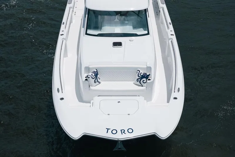 Slide: The Image of 2026 Toro Yachts Toro 42 luxury yacht on water, top view. - 5
