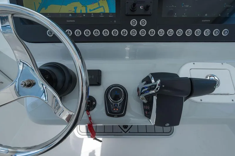 Slide: The Image of Helm of 2026 Toro Yachts Toro 42 with advanced navigation controls and steering wheel. - 23