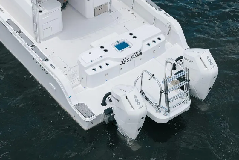 Slide: The Image of 2026 Toro Yachts Toro 42 with dual Mercury 400 engines on water. - 4