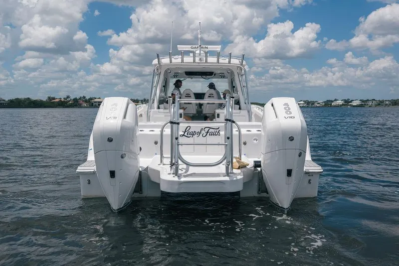 Slide: The Image of 2026 Toro Yachts Toro 42 on water, featuring dual engines and sleek design. - 7