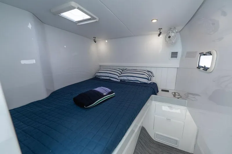 Slide: The Image of Luxurious cabin interior of 2026 Toro Yachts Toro 42 with cozy bedding. - 57