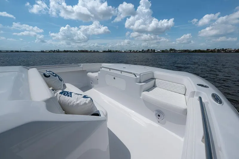 Slide: The Image of Luxurious 2026 Toro Yachts Toro 42 deck with plush seating, overlooking serene waters. - 38