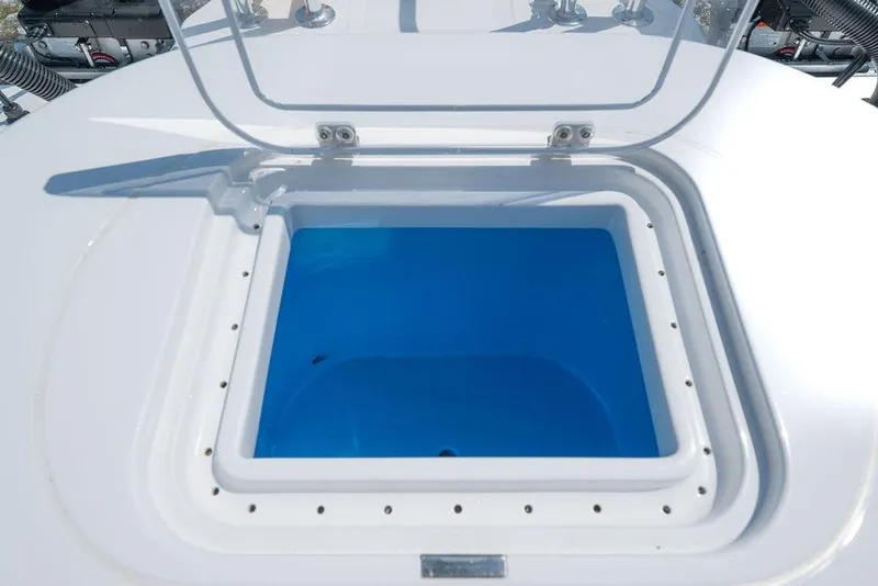 Slide: The Image of Open hatch on 2026 Toro Yachts Toro 42, revealing blue interior compartment. - 42