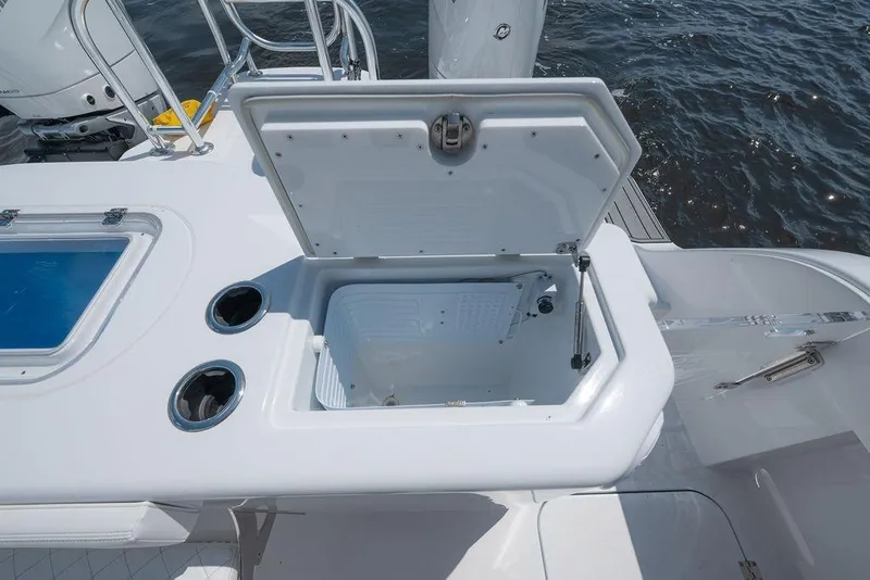 Slide: The Image of Open storage compartment on 2026 Toro Yachts Toro 42, featuring sleek design and ocean backdrop. - 41