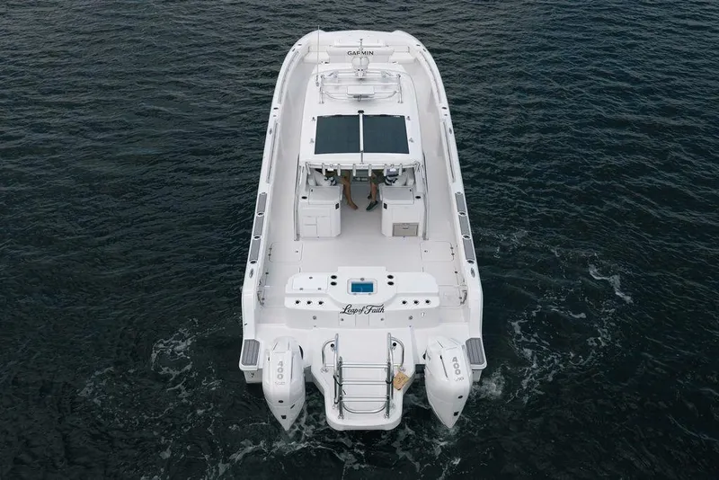 Slide: The Image of 2026 Toro Yachts Toro 42 cruising on open water, aerial view. - 3