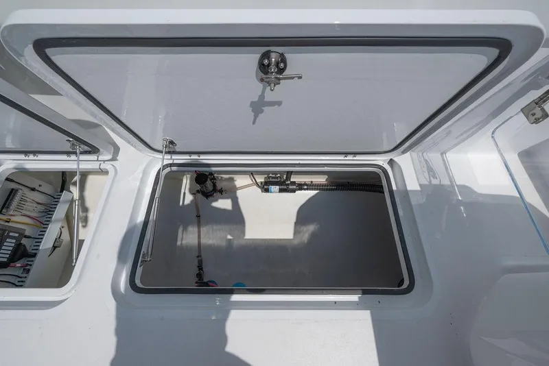 Slide: The Image of Open storage compartment on 2026 Toro Yachts Toro 42, showcasing interior details and equipment. - 25