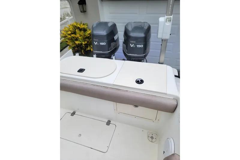 Slide: The Image of 1999 Mako 252 Center Console boat with dual Yamaha V6 150 engines. - 27