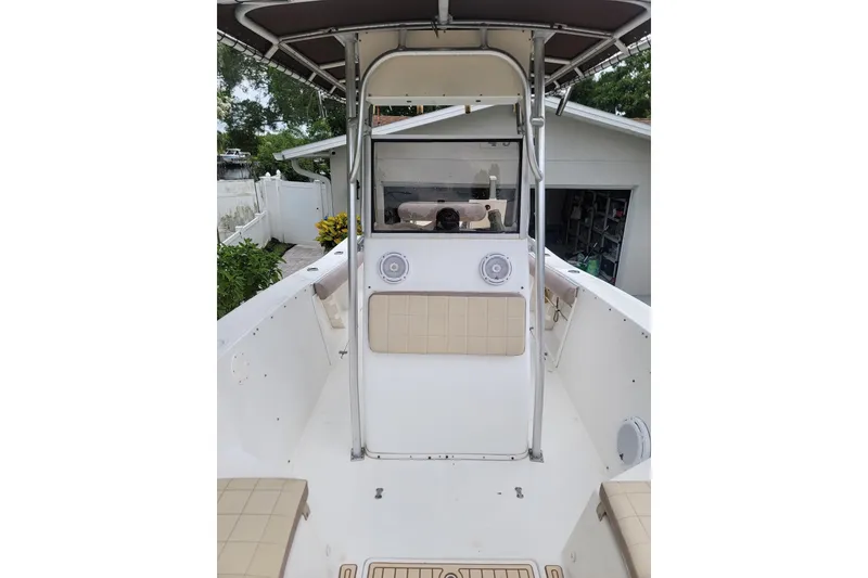 Slide: The Image of 1999 Mako 252 Center Console boat interior with seating and console view. - 18