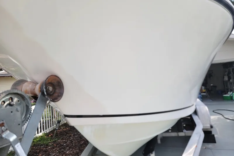 Slide: The Image of 1999 Mako 252 Center Console boat on trailer, close-up of bow and winch. - 29