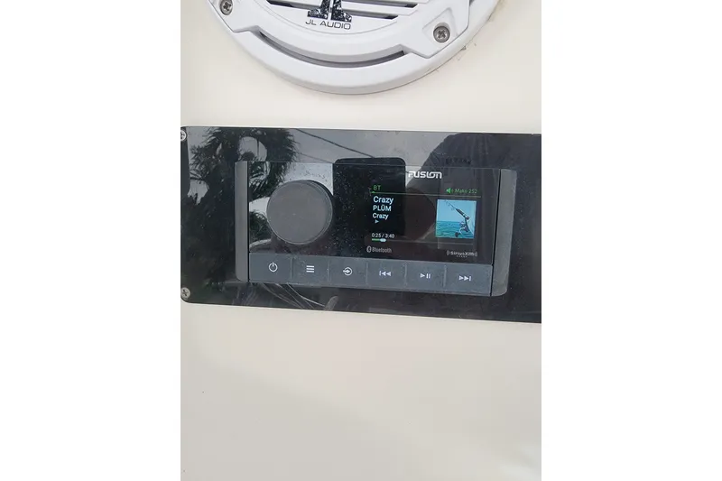 Slide: The Image of Fusion marine stereo system on a 1999 Mako 252 Center Console boat. - 28