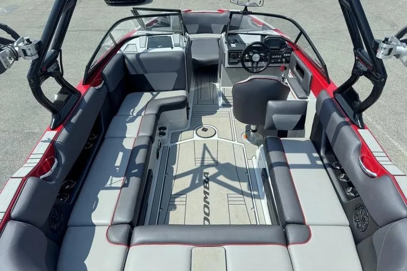 Slide: The Image of 2020 Moomba Max boat interior with spacious seating and modern dashboard. - 12