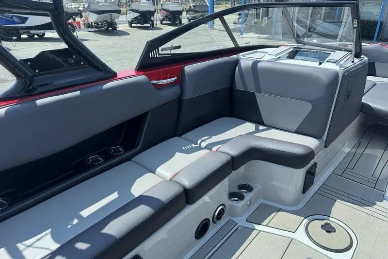 Slide: The Image of 2020 Moomba Max boat interior with gray seating and modern design. - 16