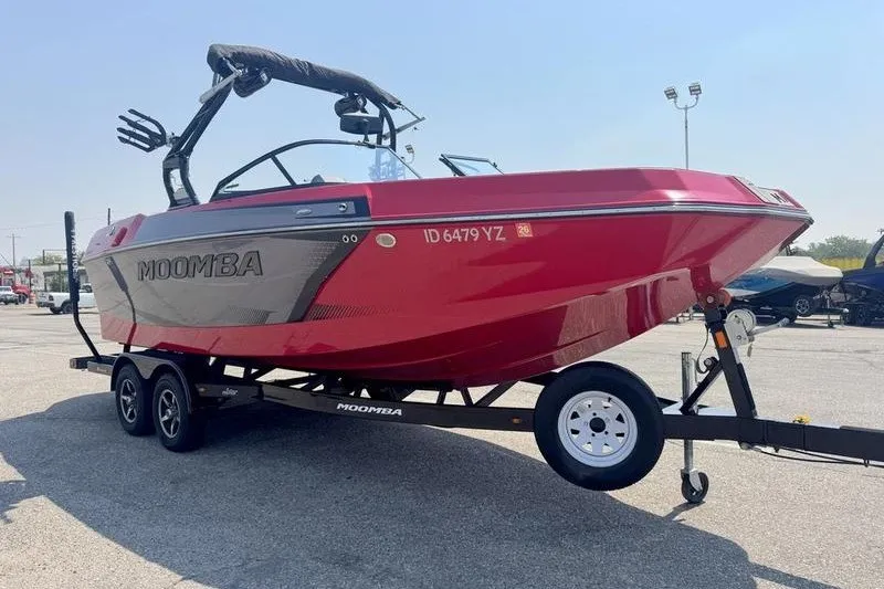 Slide: The Image of 2020 Moomba Max boat on trailer, vibrant red color, parked outdoors. - 3
