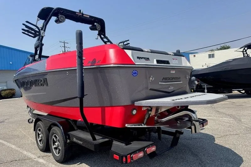 Slide: The Image of 2020 Moomba Max boat on trailer, featuring sleek design and vibrant red accents. - 8