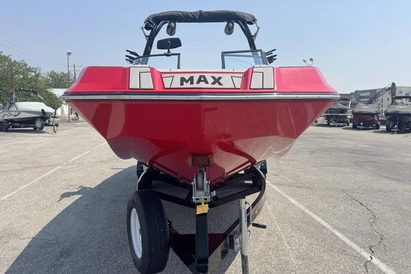Slide: The Image of Red 2020 Moomba Max boat on trailer in parking lot, front view. - 5