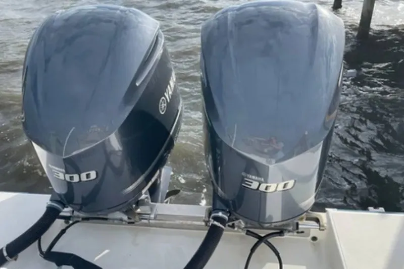 Slide: The Image of Twin Yamaha 300 outboard engines on a 2004 Venture 34 Cuddy boat. - 6