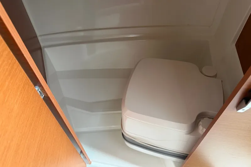 Slide: The Image of Compact marine toilet in 2017 Jeanneau Merry Fisher 695 boat cabin. - 15