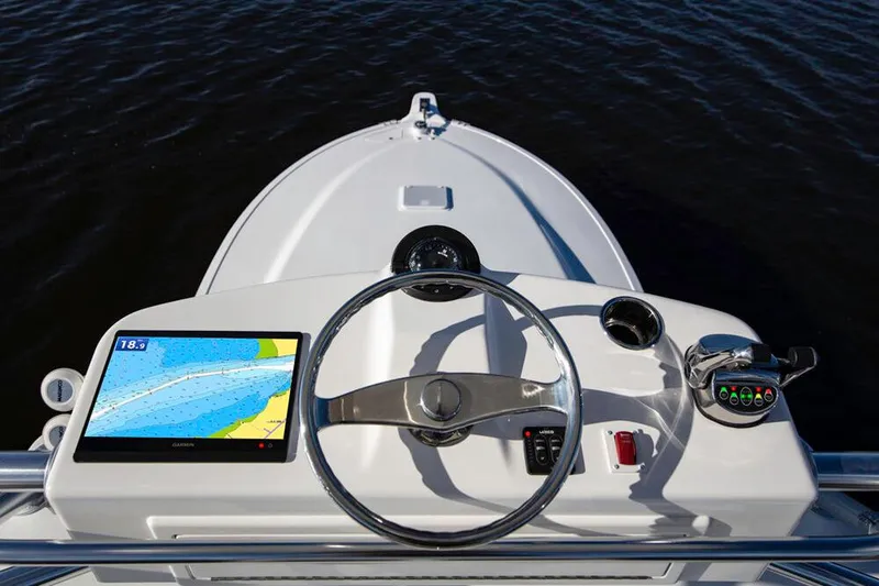 Slide: The Image of The image shows the helm of a 2023 Albemarle 41 Custom Carolina Edition boat with a navigation screen. - 7
