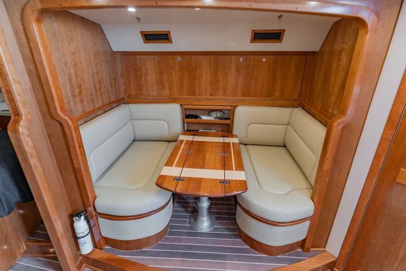 Slide: The Image of Luxurious interior of 2023 Albemarle 41 Custom Carolina Edition with elegant wood finish and cozy seating. - 20