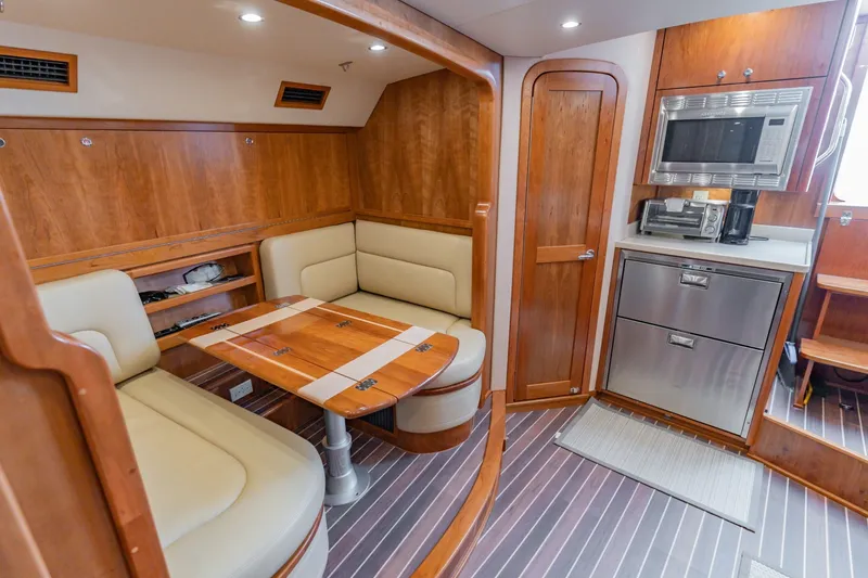 Slide: The Image of Luxurious interior of 2023 Albemarle 41 Custom Carolina Edition yacht with wood finishes and modern amenities. - 19