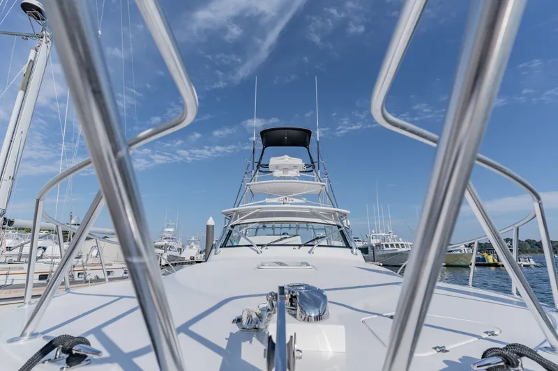 Slide: The Image of 2023 Albemarle 41 Custom Carolina Edition yacht docked under clear blue sky. - 26