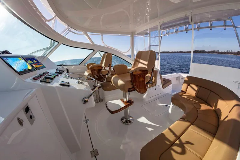 Slide: The Image of The image shows the cockpit of a 2023 Albemarle 41 Custom Carolina Edition with modern seating and electronics. - 10