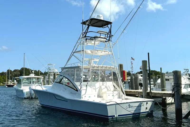 Slide: The Image of Albemarle 41 Custom Carolina Edition 2023 at the dock with a blue sky. - 4