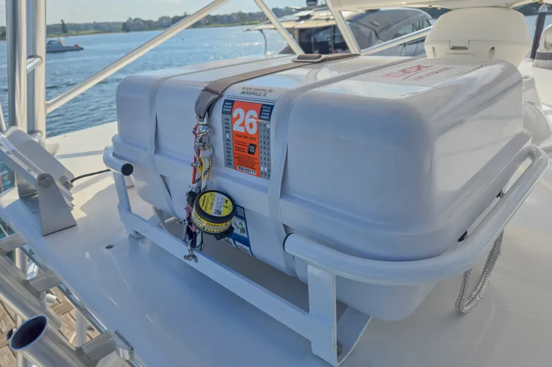 Slide: The Image of Safety equipment on 2023 Albemarle 41 Custom Carolina Edition boat, docked by the water. - 28