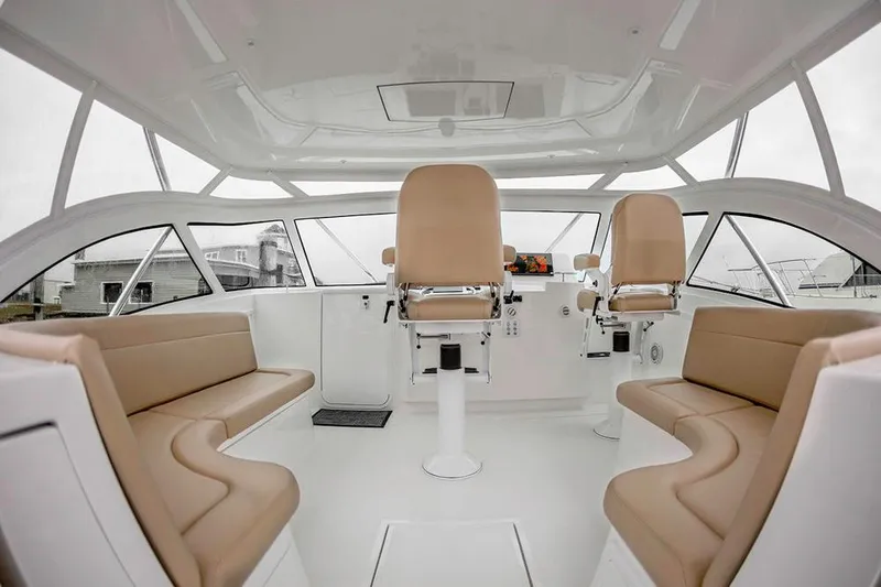 Slide: The Image of Interior of a modern yacht with beige seating and large windows. - 13