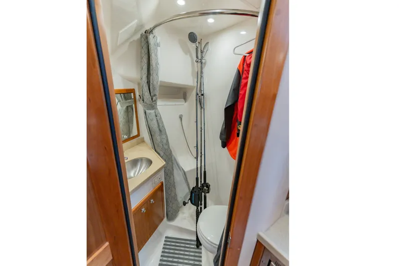 Slide: The Image of 2023 Albemarle 41 Custom Carolina Edition bathroom with shower, sink, and storage. - 25
