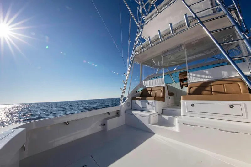 Slide: The Image of The image shows the deck of a 2023 Albemarle 41 Custom Carolina Edition on open water. - 8