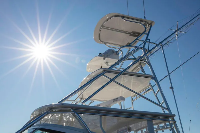 Slide: The Image of The image shows the upper helm of an Albemarle 41 Custom Carolina Edition under a bright blue sky. - 6