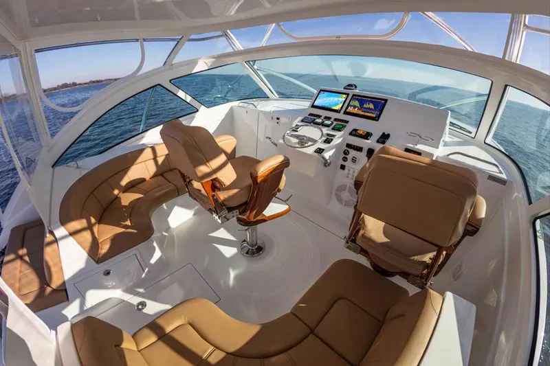 Slide: The Image of Interior of the 2023 Albemarle 41 Custom Carolina Edition with luxurious seating and modern controls. - 11