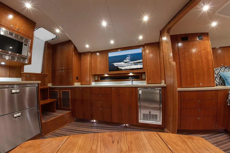 Slide: The Image of Interior of the 2023 Albemarle 41 Custom Carolina Edition with elegant wood furnishings and modern amenities. - 15