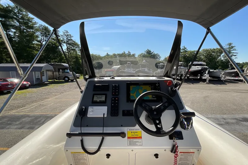 Slide: The Image of 2024 Sealegs 7.5M boat dashboard with navigation system and steering wheel. - 20