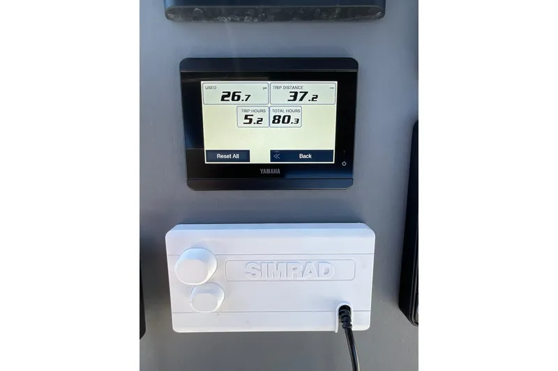 Slide: The Image of Yamaha display and Simrad control panel on 2024 Sealegs 7.5M boat dashboard. - 18