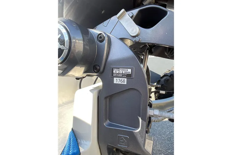 Slide: The Image of Close-up of a 2024 Sealegs 7.5M boat engine component with identification label. - 34