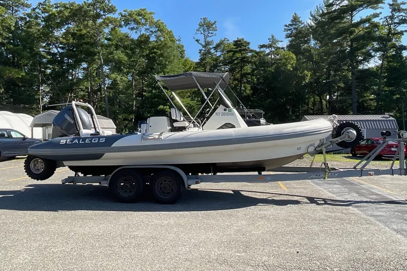 The Image of 2024 Sealegs 7.5M amphibious boat on trailer in parking lot. - 1