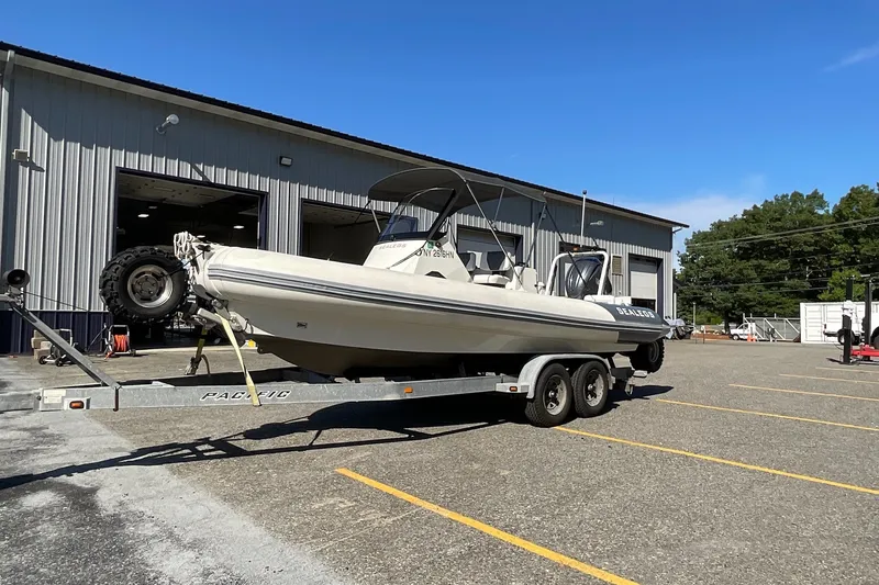 Slide: The Image of 2024 Sealegs 7.5M boat on trailer outside a warehouse. - 4