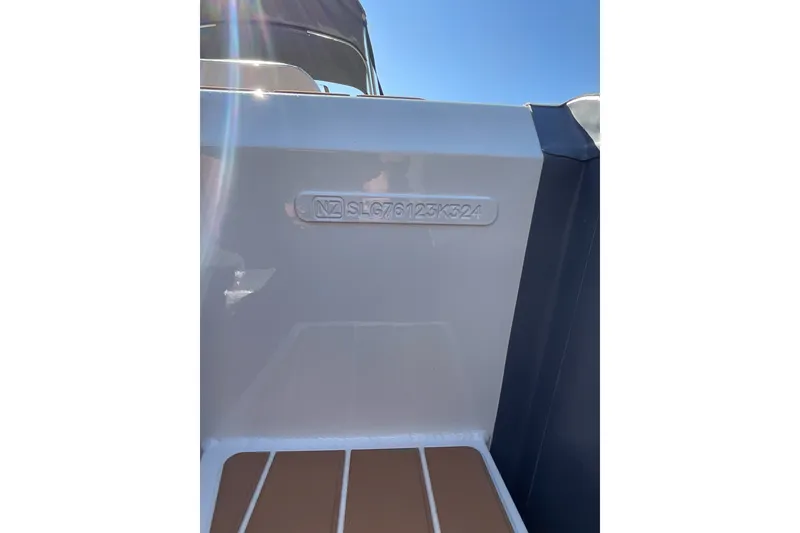 Slide: The Image of 2024 Sealegs 7.5M boat hull identification number on display under clear blue sky. - 11