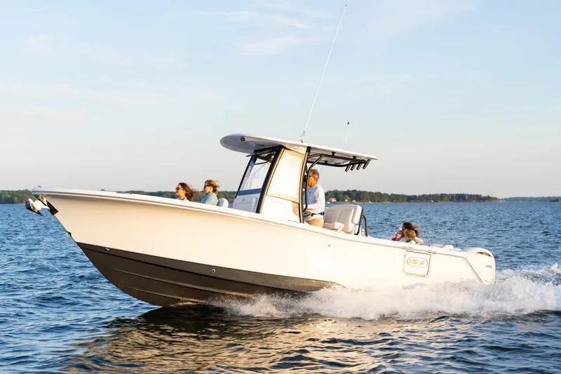 Slide: The Image of 2027 Sea Hunt Ultra 265SE boat cruising on a sunny day with passengers onboard. - 45