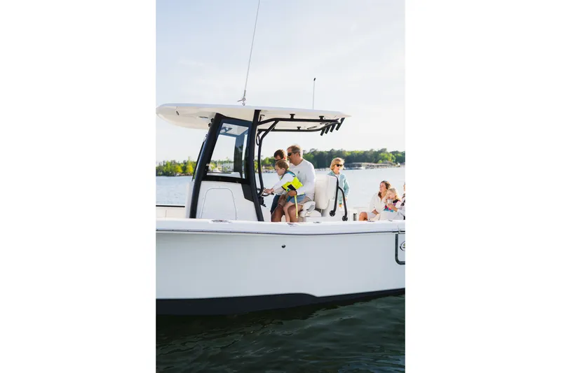 Slide: The Image of Family enjoying a day on the 2027 Sea Hunt Ultra 265SE boat. - 30