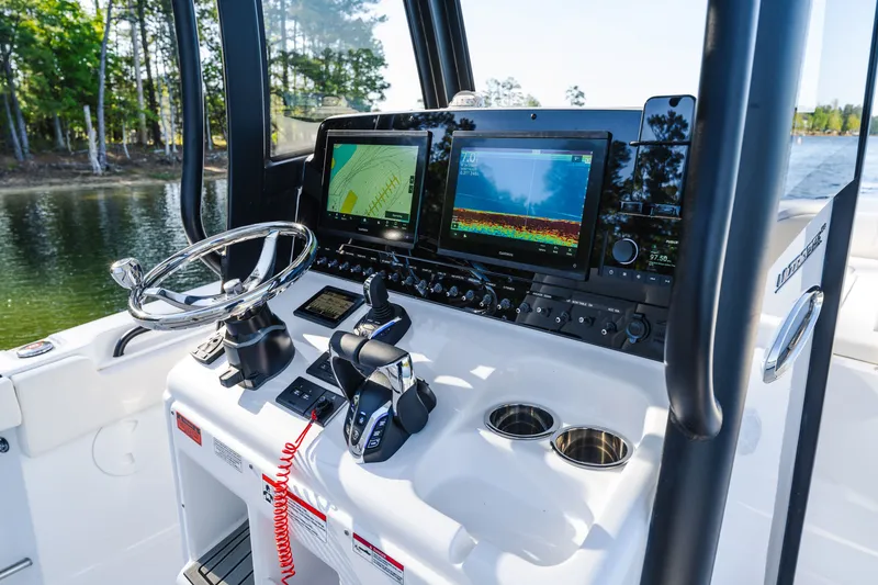 Slide: The Image of 2027 Sea Hunt Ultra 265SE boat dashboard with advanced navigation and control systems. - 20