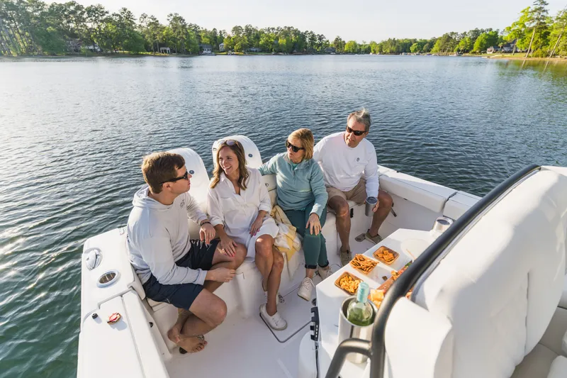 Slide: The Image of Group enjoying a sunny day on a 2027 Sea Hunt Ultra 265SE boat. - 36